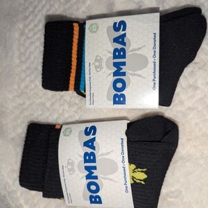 Bombas Black Crew Socks with Orange Accent Stripe and Yellow Logo